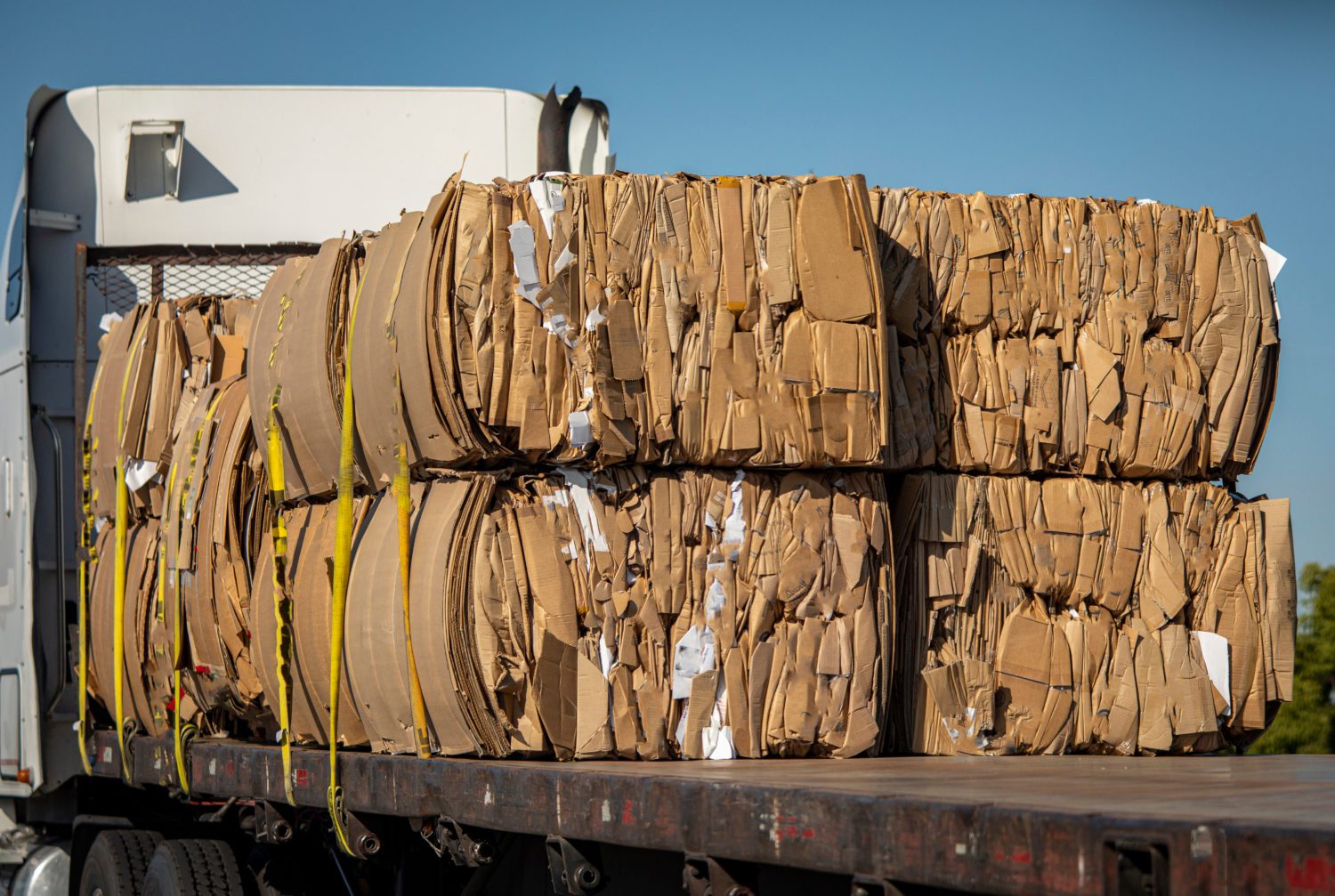 Bales of cardboard boxes on the back of a truck